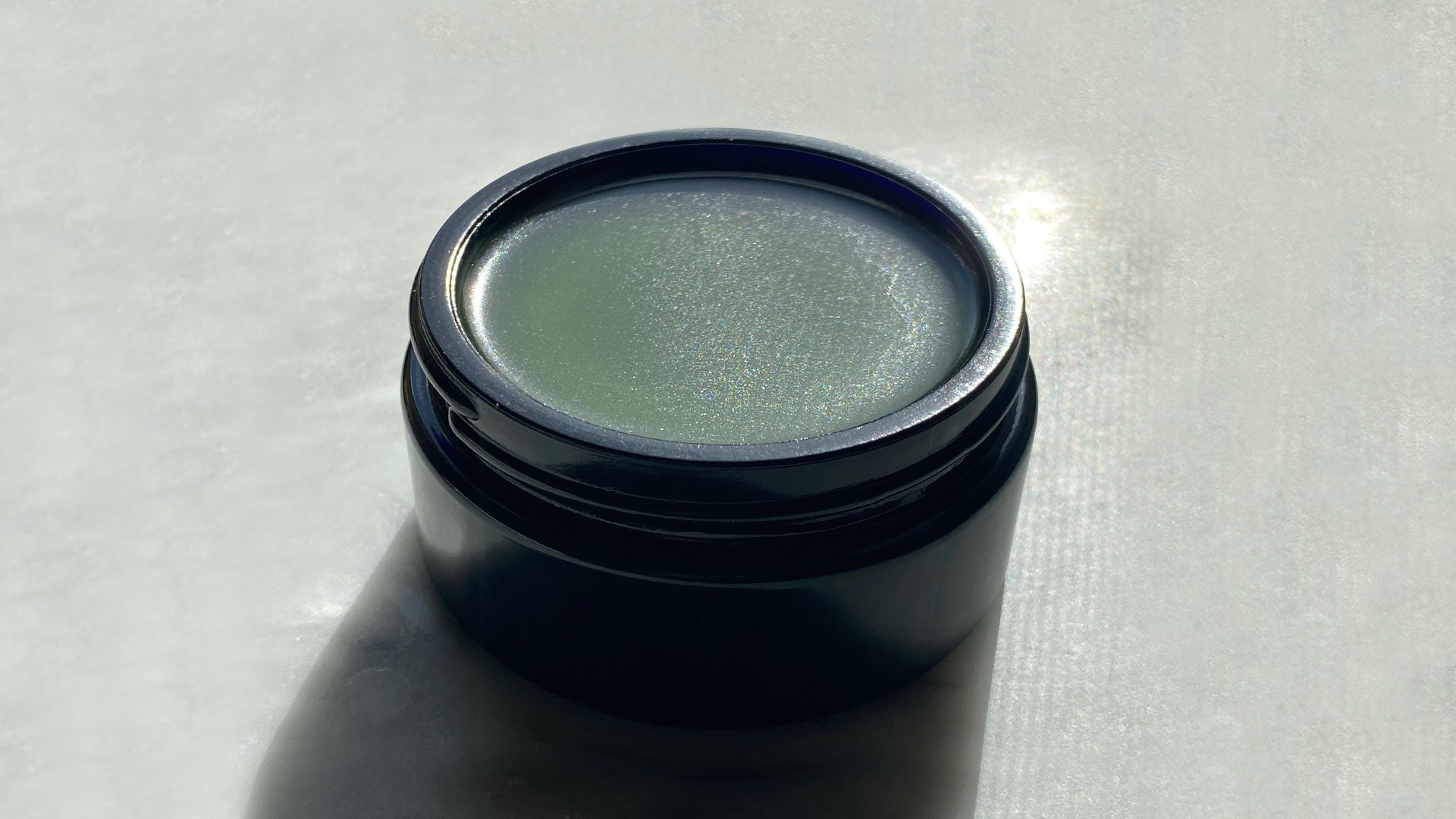 Temple Tree botanical balm, photographed in natural light